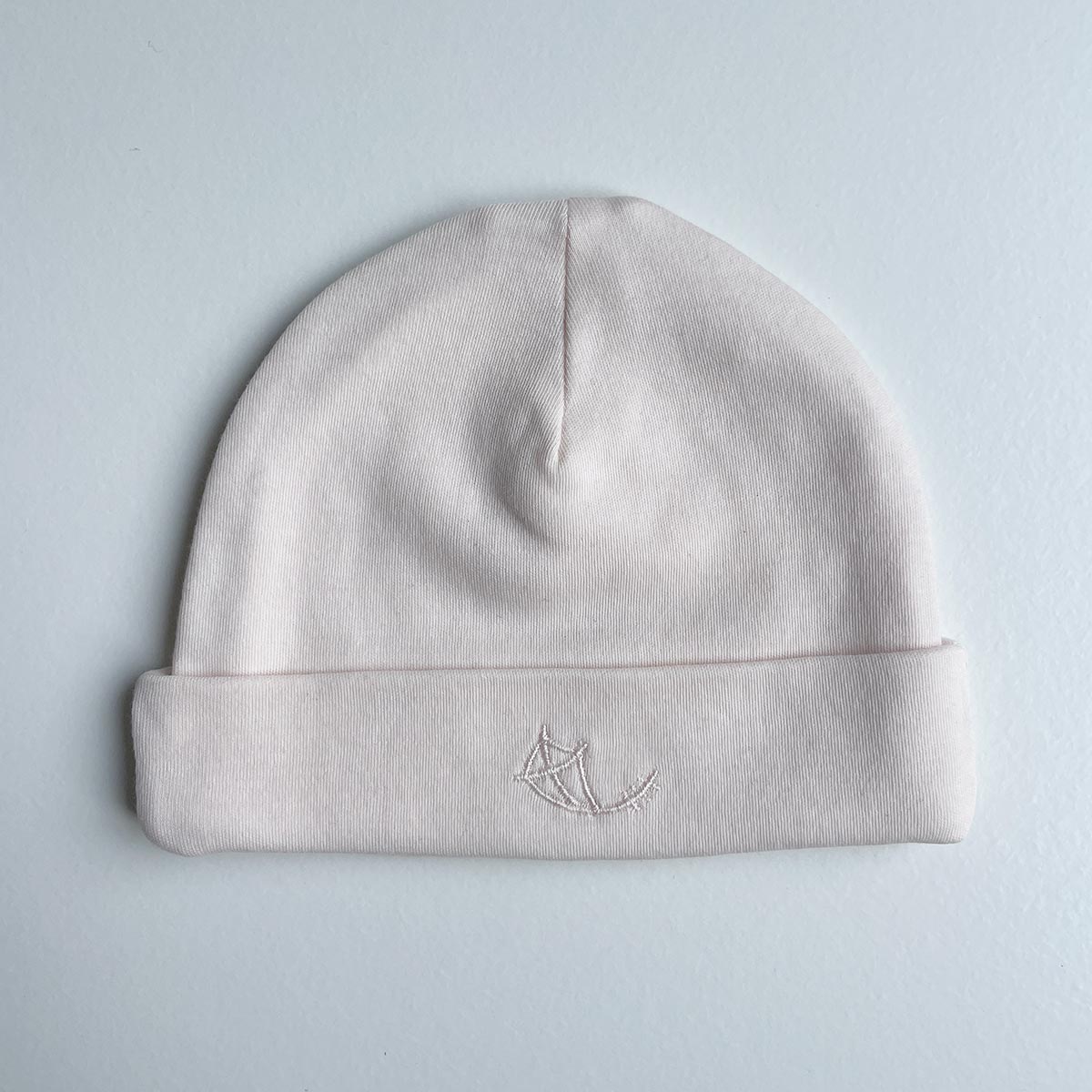 Krämrosa babymössa i mjuk ekologisk pimabomull