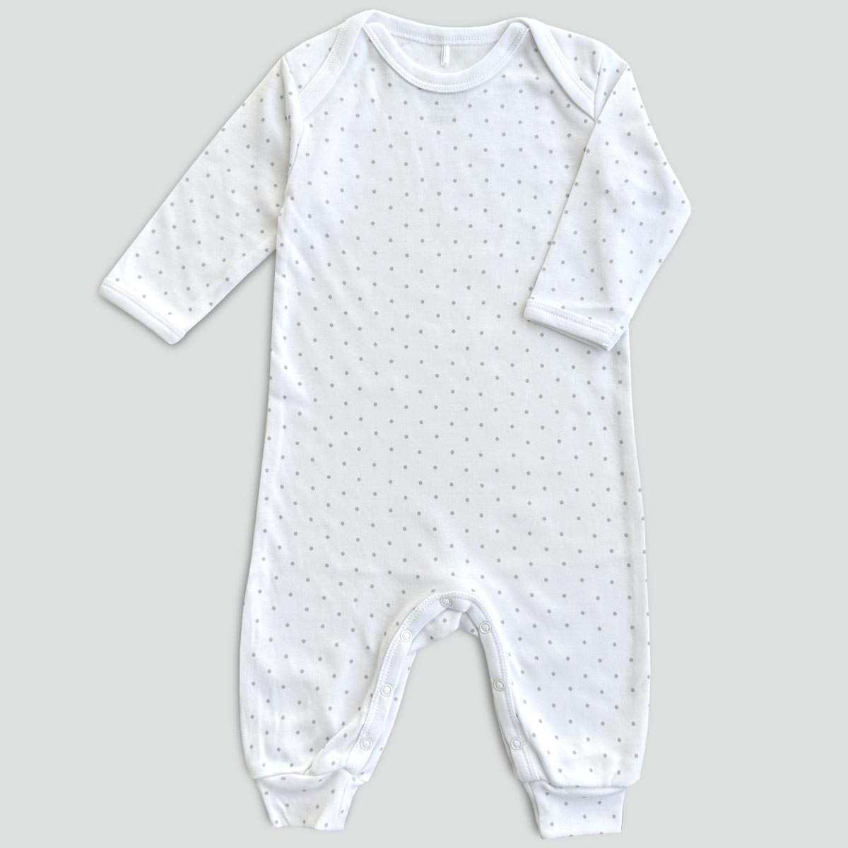 Vit bomullsonesie för bebis med grå prickar